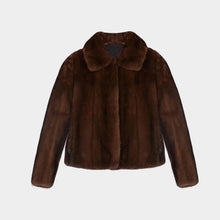 Brown fur jacket on a light gray background