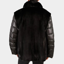 Black puffer jacket with fur trim on a white background