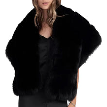 Black fur vest worn by a model on a white background