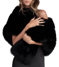 Black fur shrug worn by a person on a white background